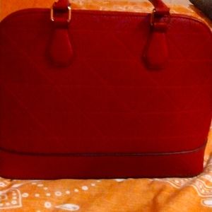 Red purse brand name